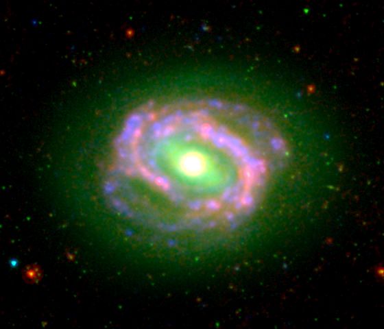 M58 (NGC 4579) as seen in ultraviolet and infrared emission